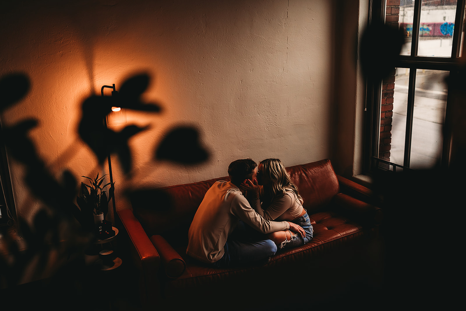 Two people in a domestic interior from Rylee’s existing documentary archive