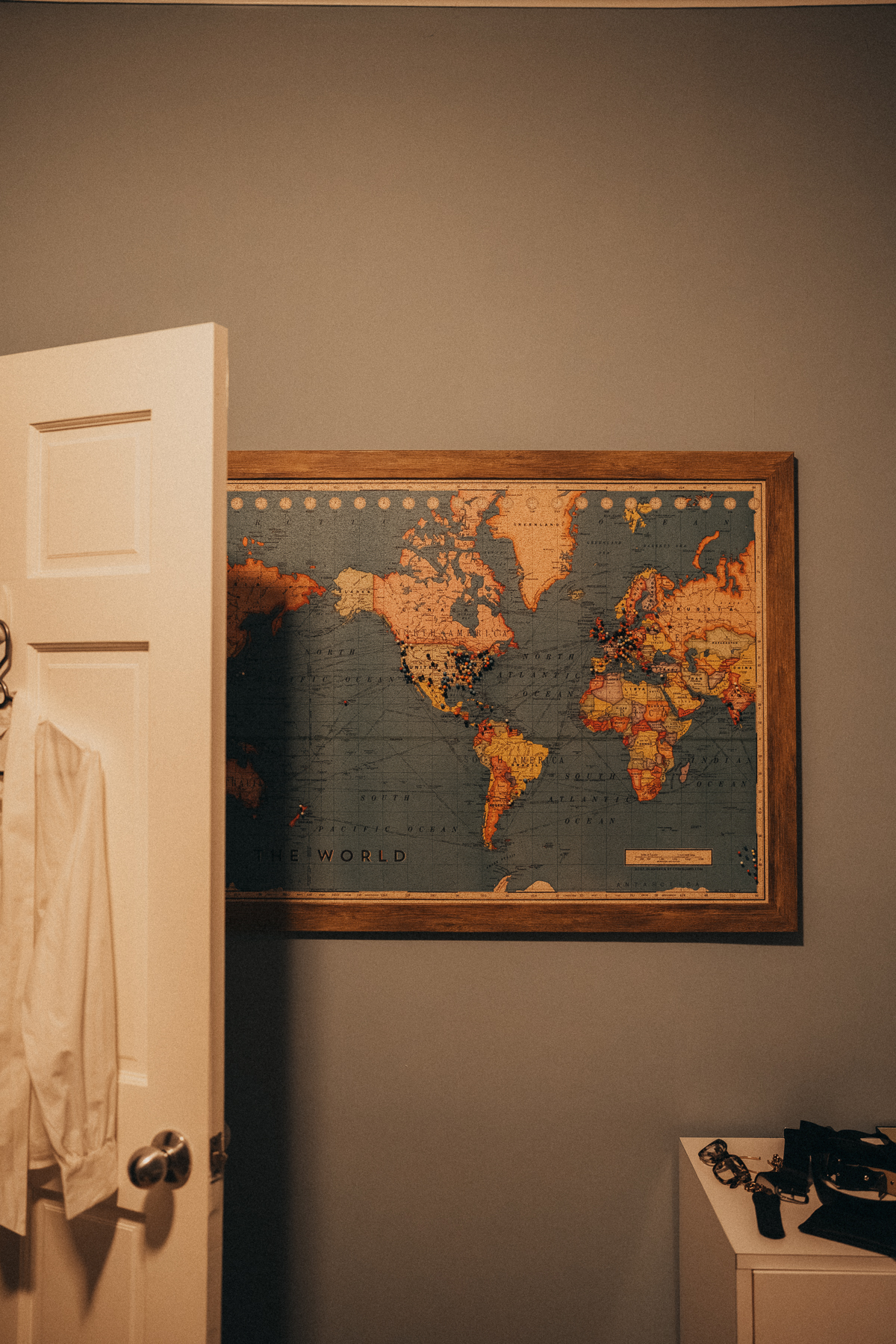 A pin-covered world map inside the temporary home
